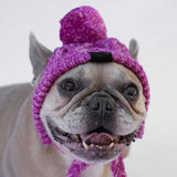 Chapeau en laine rose avec pompon