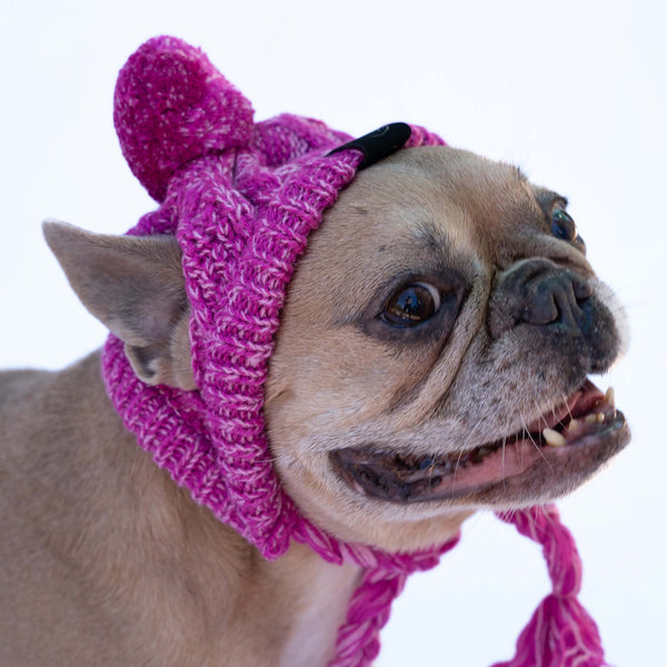 Chapeau en laine rose avec pompon